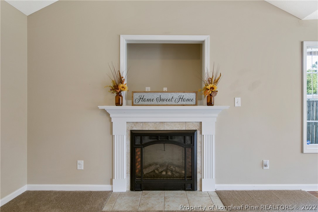 654 Hogart Street Raeford, NC 28376 - Photo 10 of 35 a living room with a fireplace