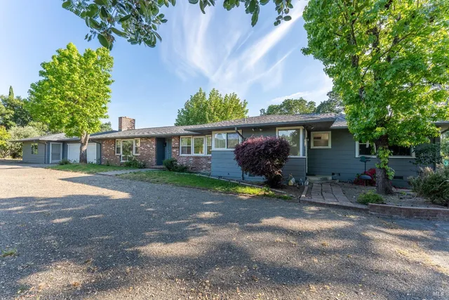 an empty room with large windows