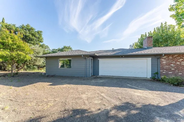 a kitchen that has a sink and a stove in it