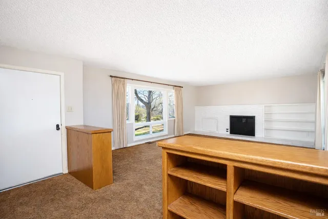 a kitchen with a sink cabinets and wooden floor