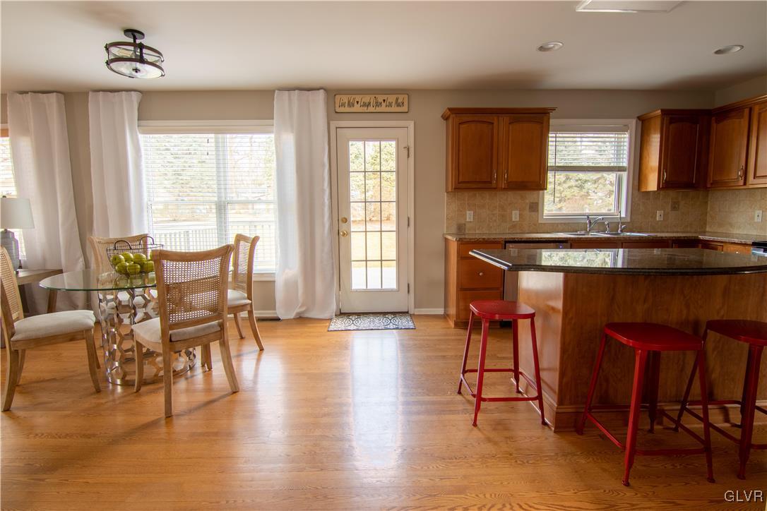2136 Terry Road Nazareth, PA 18064 - Photo 7 of 39 a kitchen with stainless steel appliances granite countertop table chairs and a large window