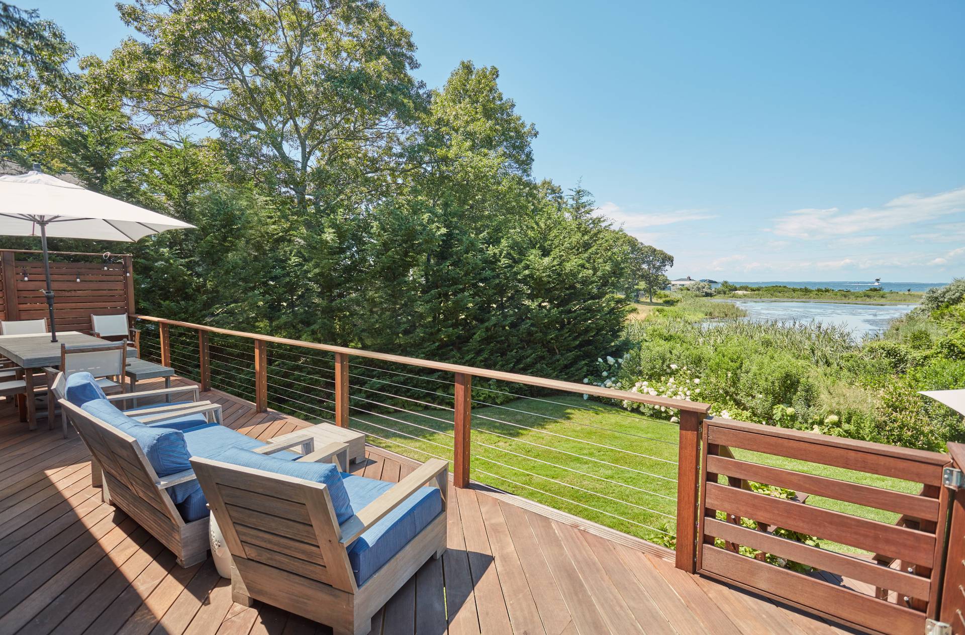 6 Bay Inlet Road East Hampton, NY 11937 - Photo 15 of 50 a view of a balcony with two chairs and a table