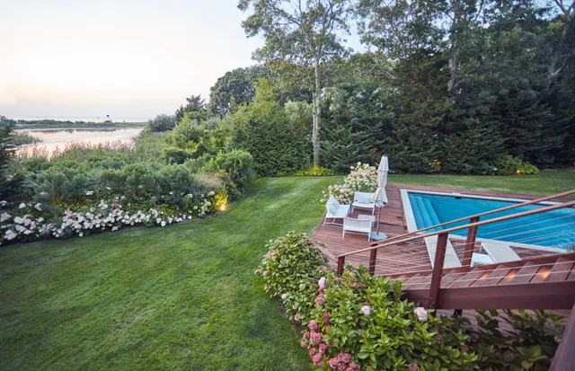 a view of a backyard with sitting area