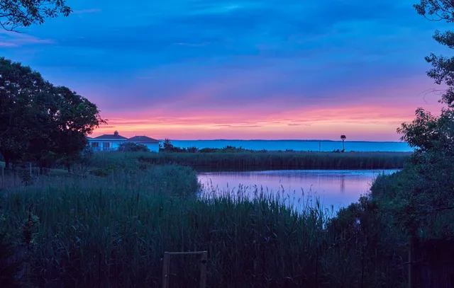 a view of lake with mountain in background