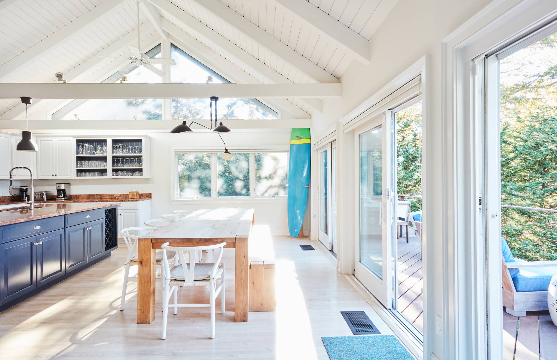 6 Bay Inlet Road East Hampton, NY 11937 - Photo 25 of 50 a dining room with wooden floor and large windows