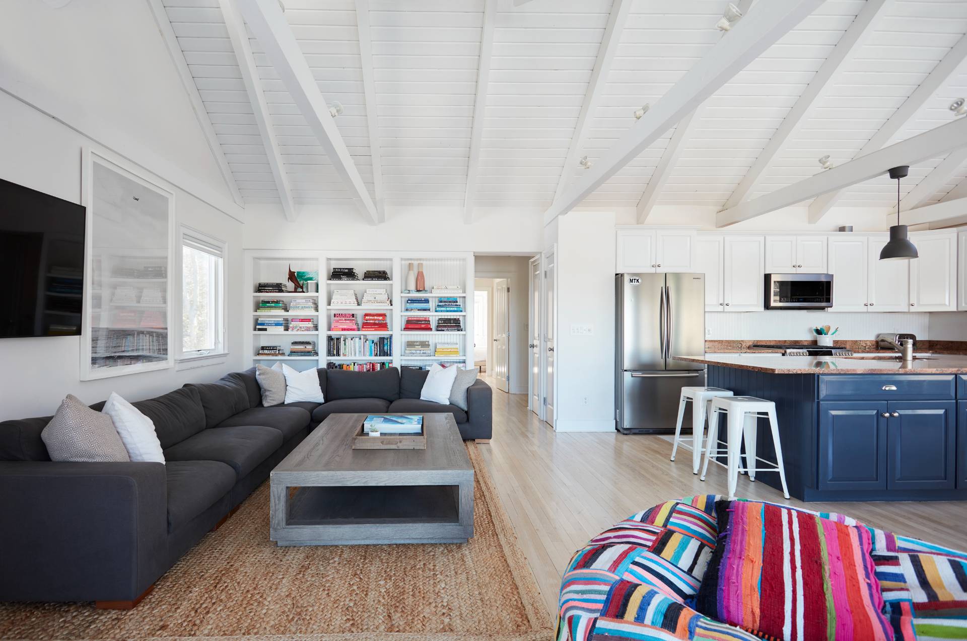 6 Bay Inlet Road East Hampton, NY 11937 - Photo 28 of 50 a living room with furniture a rug kitchen view and a window