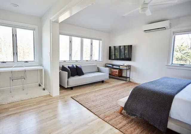 a living room with a couch and a flat screen tv