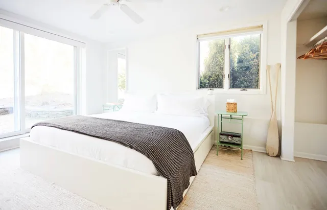 a bedroom with a bed and window