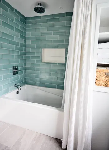 a bedroom with a bed and a chair