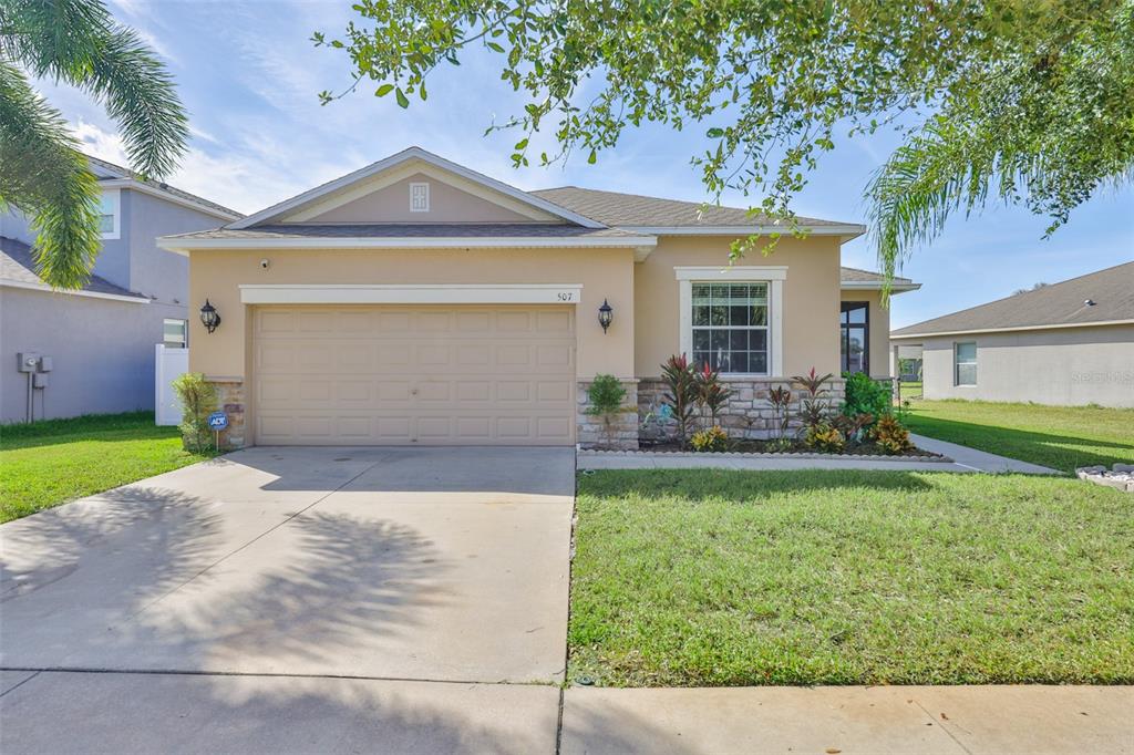 a front view of a house with garden