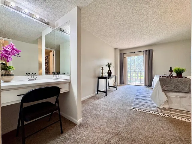 a en suite bathroom with a sink and a mirror