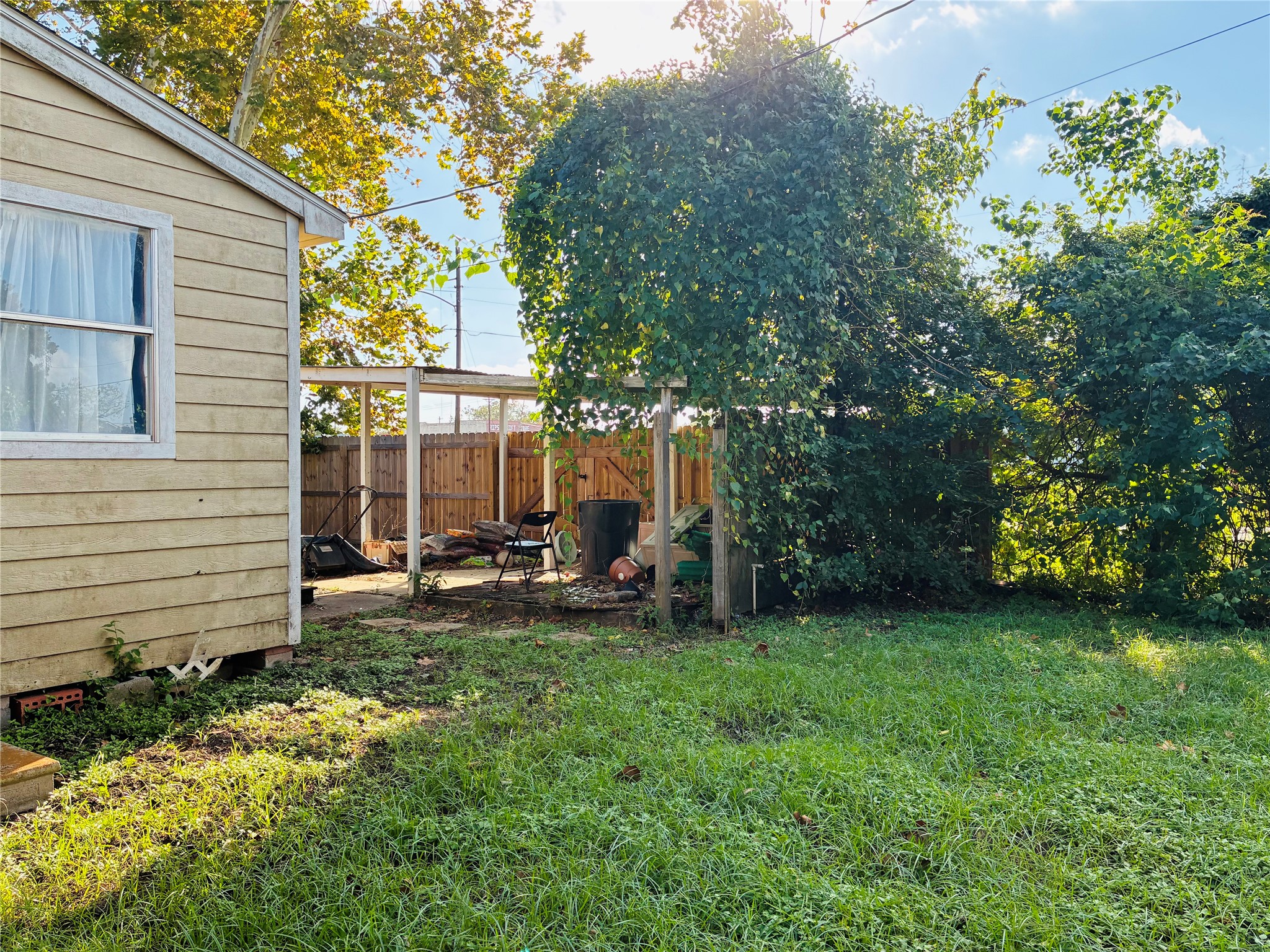201 East Front Street Brazoria, TX 77422 - Photo 13 of 13 a view of a house with backyard sitting area and garden