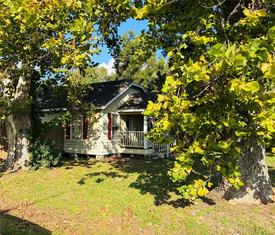 a view of a house with a tree