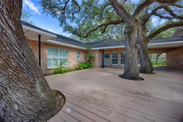 a house with trees in front of it