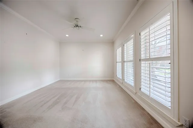 an empty room with windows and entrance