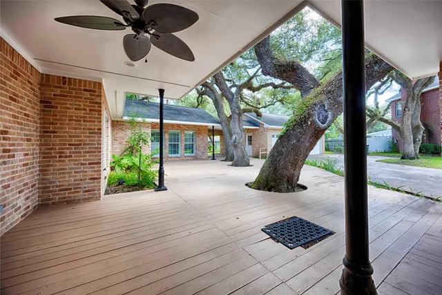 a view of a porch with wooden floor