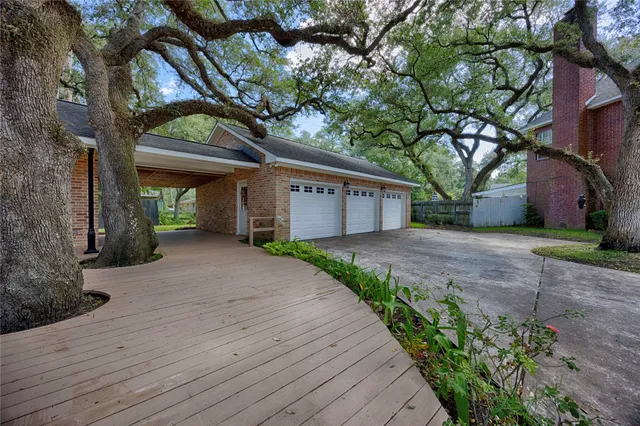 a view of a house with a tree