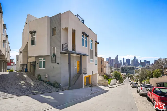 a view of a street with cars