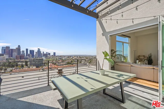 a view of a terrace with furniture and a potted plant