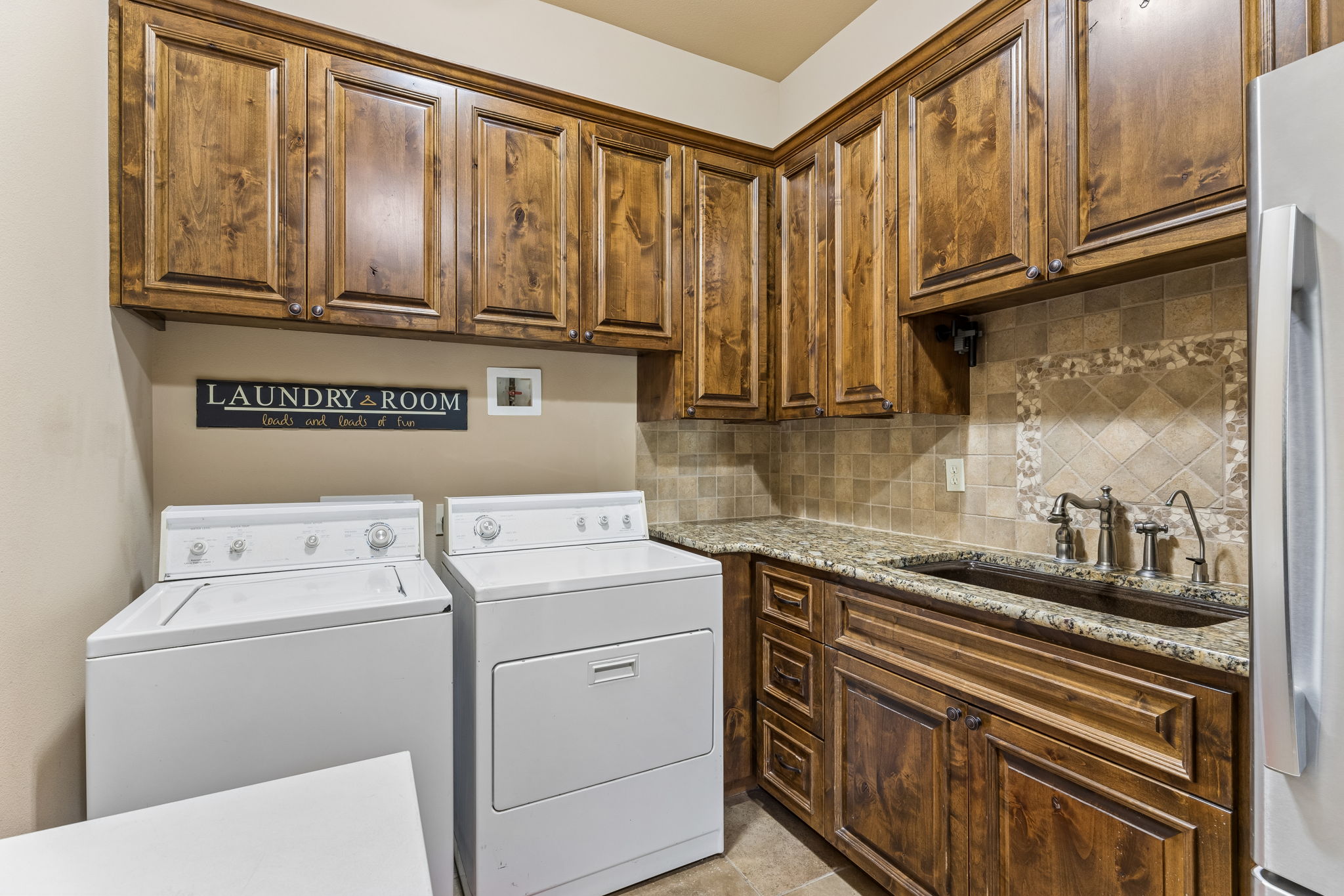 438 Patricia Road Georgetown, TX 78628 - Photo 28 of 36 Large laundry room with utility sink & extra storage closet not pictured. Don't miss the appliance closet.