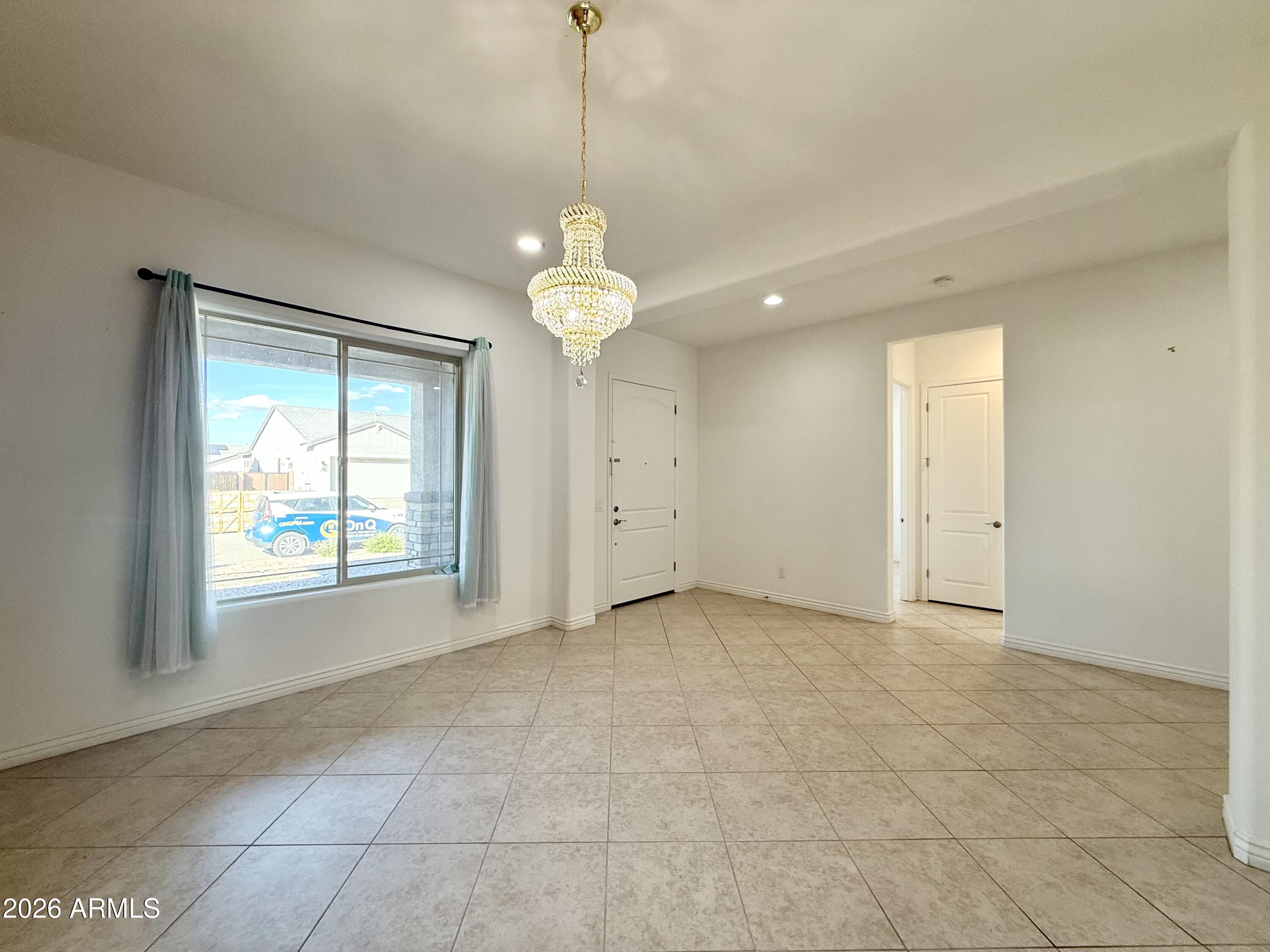 3355 East Constance Way Phoenix, AZ 85042 - Photo 12 of 42 a view of an empty room with a window