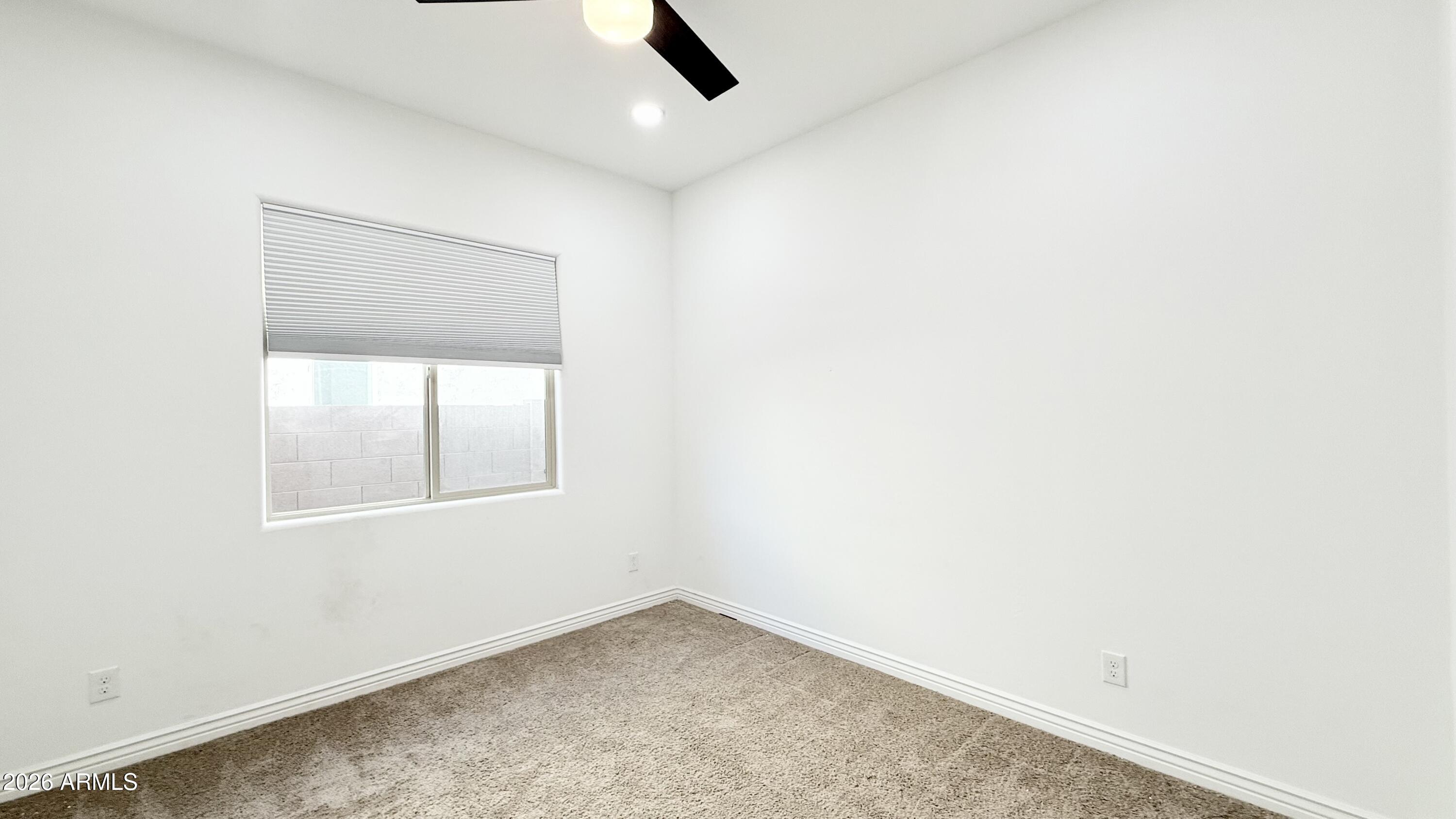3355 East Constance Way Phoenix, AZ 85042 - Photo 17 of 42 an empty room with a window