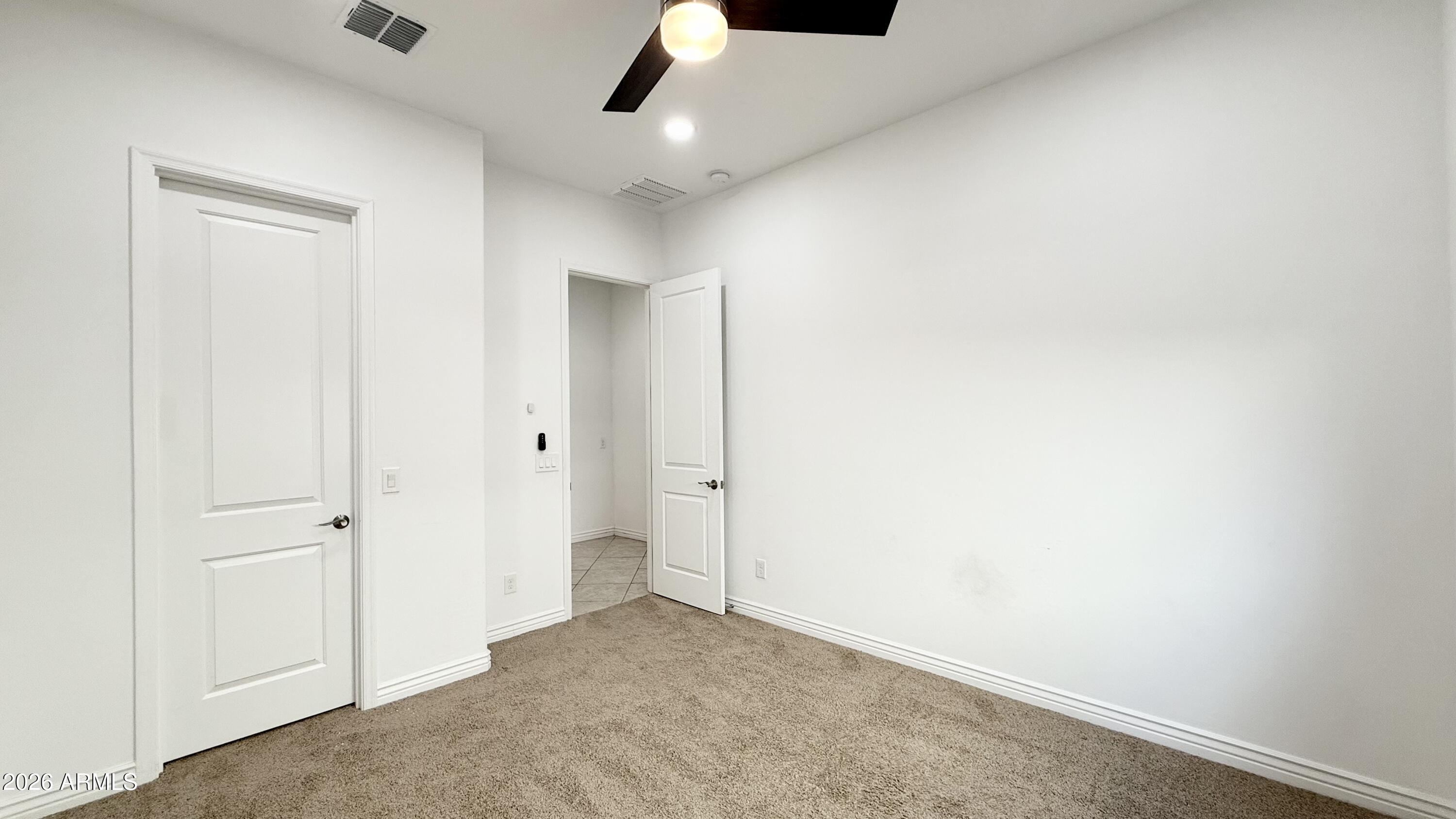 3355 East Constance Way Phoenix, AZ 85042 - Photo 18 of 42 an empty room with ceiling fan