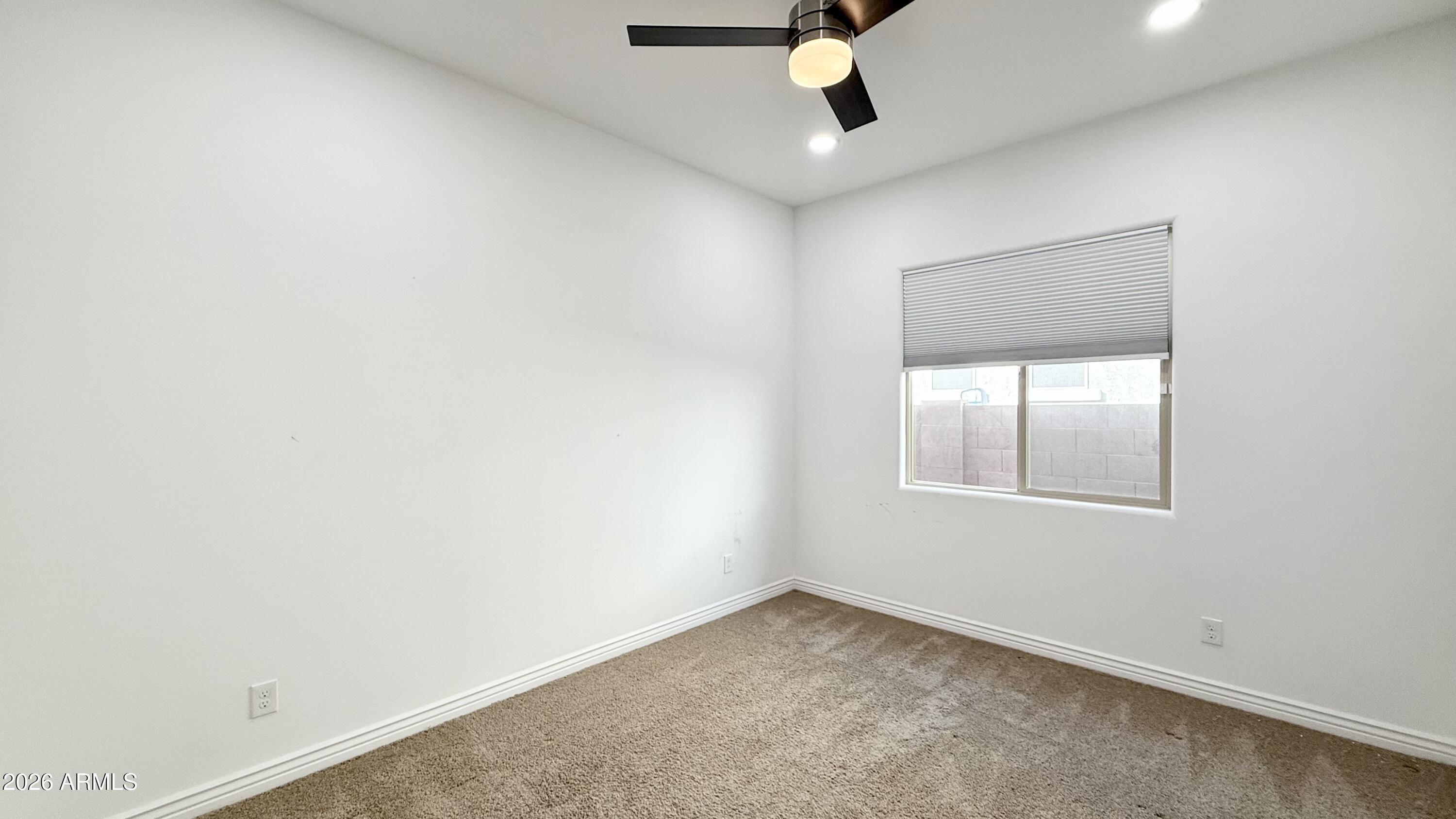 3355 East Constance Way Phoenix, AZ 85042 - Photo 20 of 42 an empty room with a window