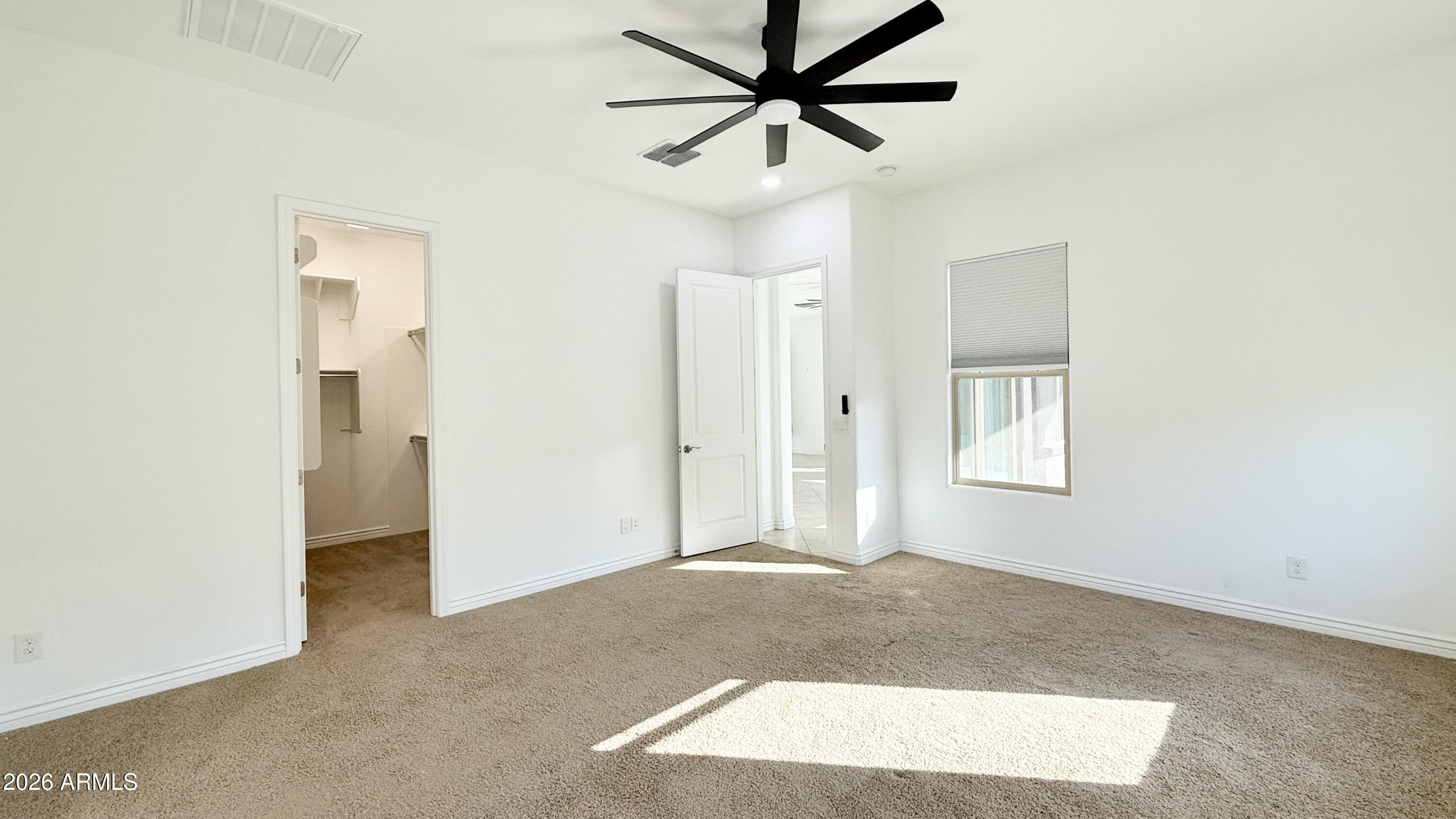 3355 East Constance Way Phoenix, AZ 85042 - Photo 22 of 42 a view of a livingroom with a ceiling fan and window