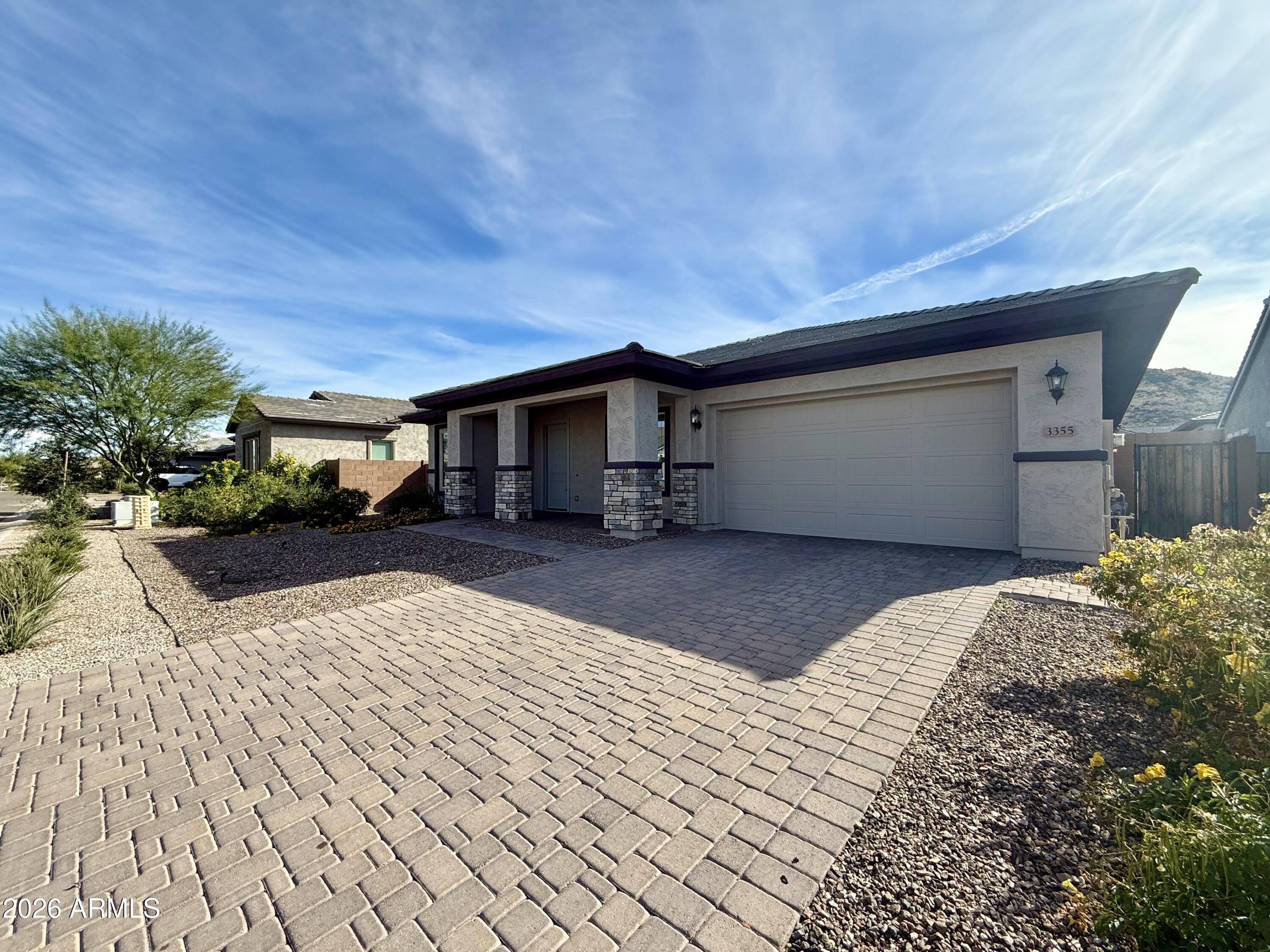 3355 East Constance Way Phoenix, AZ 85042 - Photo 3 of 42 a view of a house with a backyard
