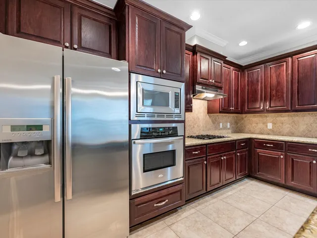 a view of a dining room with furniture wooden floor and a fireplace