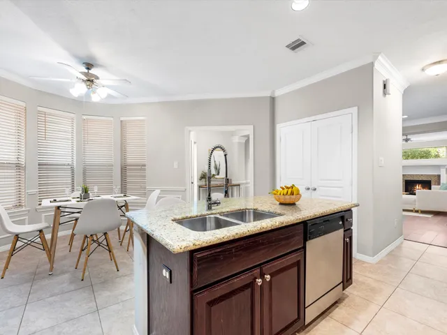 a kitchen with a sink and a stove