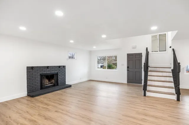 a kitchen with stainless steel appliances a sink stove and refrigerator