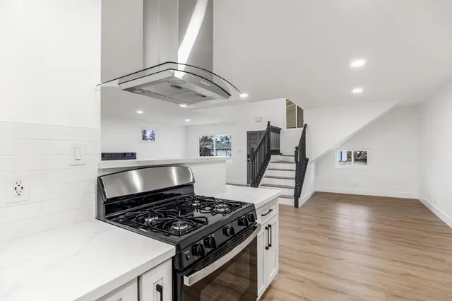 a view of a workspace with furniture and a potted plant