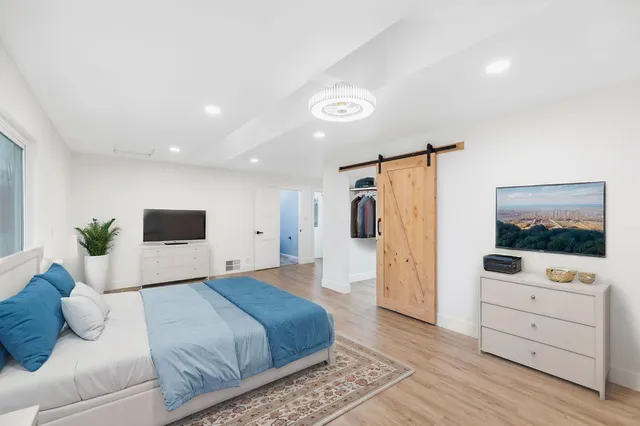 a view of a deck and yard with green space