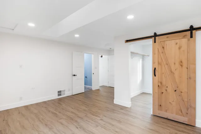 a view of swimming pool with garden and trees