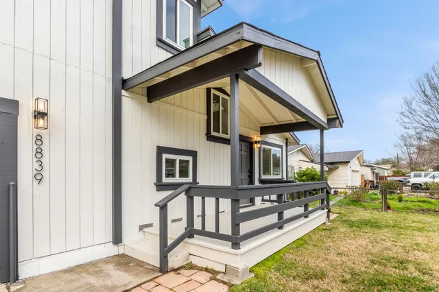 a view of an empty room and wooden floor