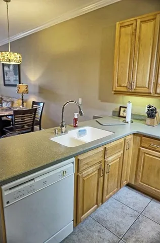 a kitchen with a sink and cabinets