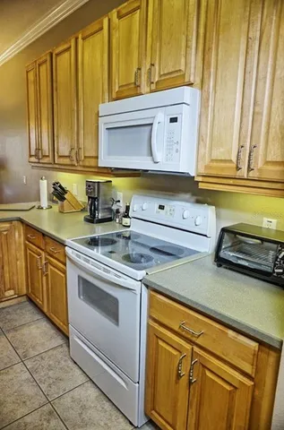 a kitchen with stainless steel appliances granite countertop a sink and cabinets