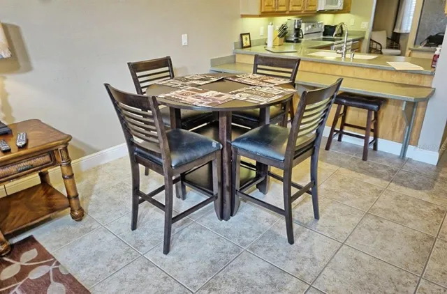a view of a dinning table and chairs in the patio