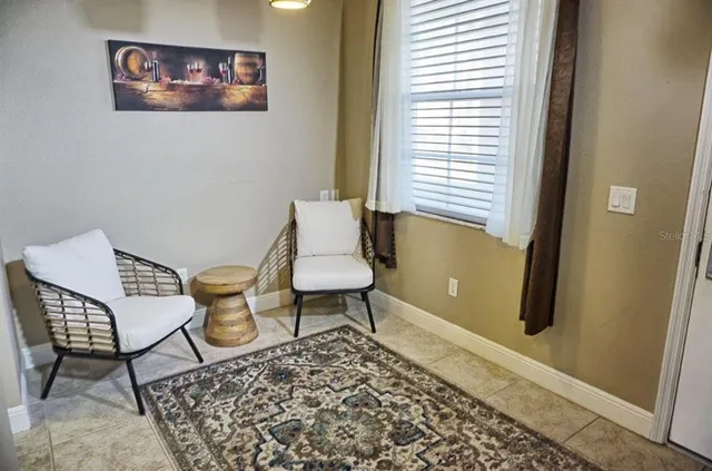 a living room with furniture and a window