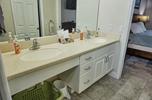 a bathroom with a sink vanity and a mirror