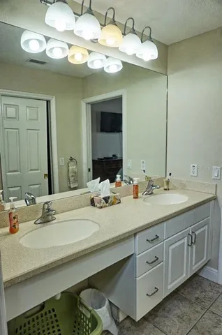 a white toilet sitting next to a bathroom sink