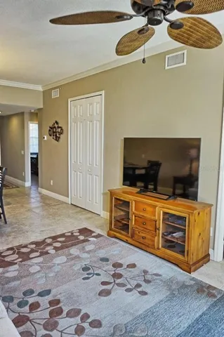 a bedroom with furniture and flat screen tv
