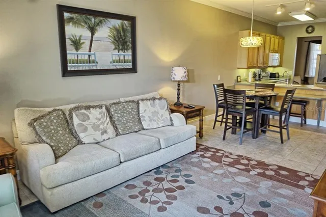 a living room with furniture a dining table and a piano table