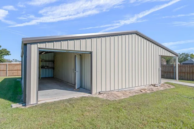 a view of backyard with cabin