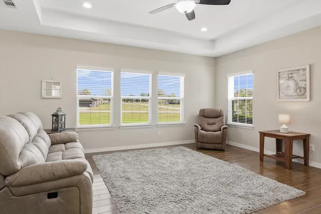 a living room with furniture and a large window