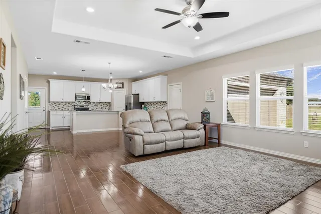 a living room with furniture and a large window