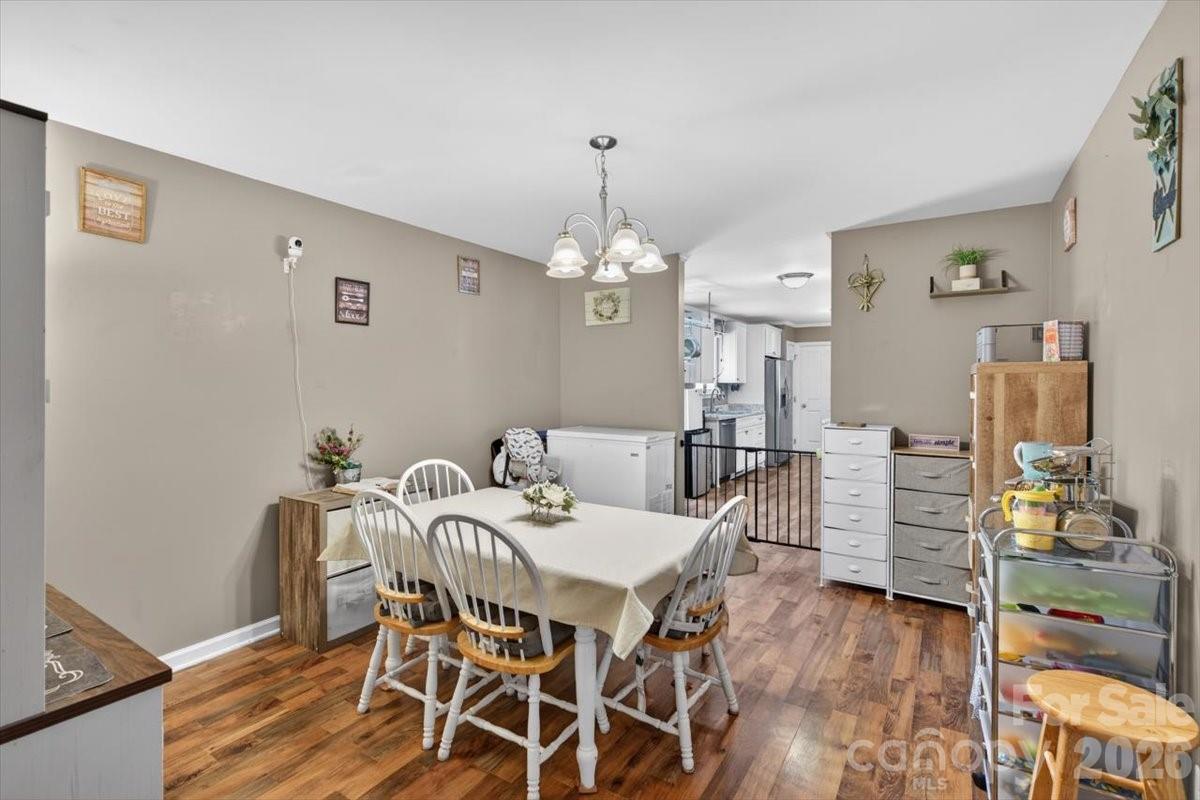 567 Godbey Road Mocksville, NC 27028 - Photo 10 of 38 a view of a dining room with furniture and wooden floor