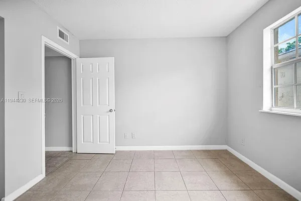 a view of an empty room and window